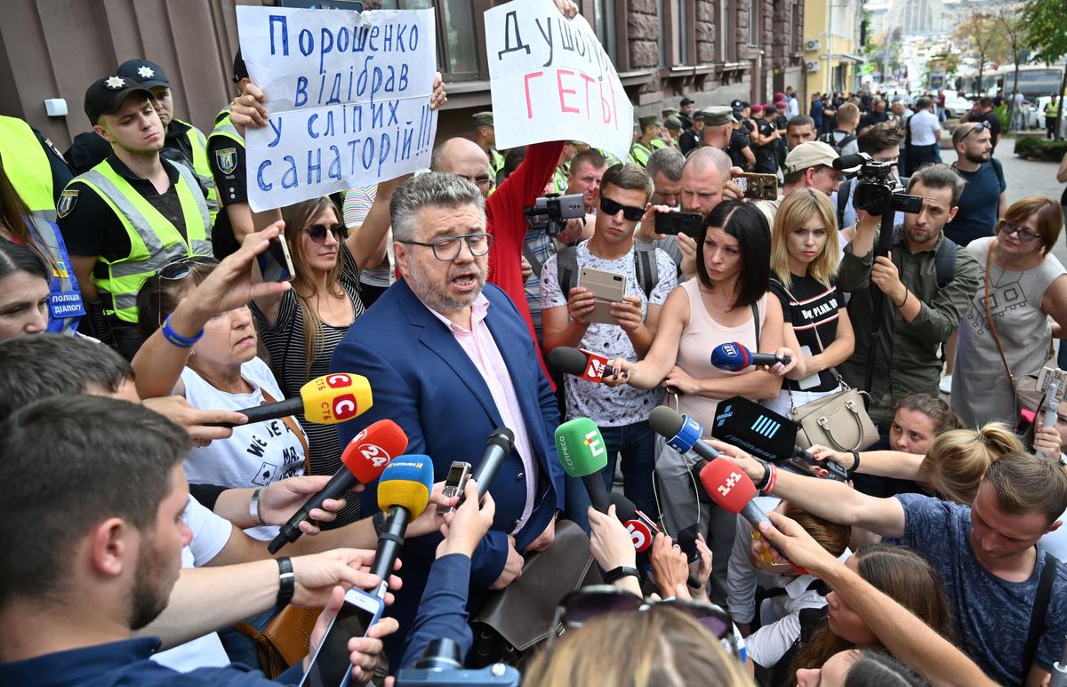 Igor Golovan, a lawyer of former Ukrainian President Petro Poroshenko, called to be questioned as a witness in a case of possible tax evasion, speaks to media in Kyiv on Sept. 3, 2019. (Sergei Supinsky/AFP/Getty Images)