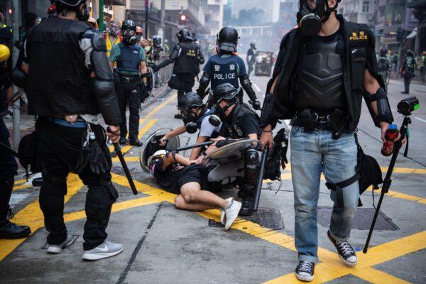 Police arrest a protester during clashes in Wan Chai in Hong Kong, China on October 1, 2019. (Laurel Chor/Getty Images)