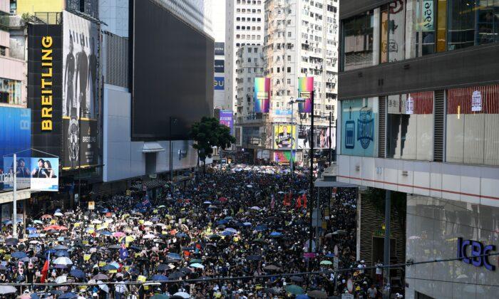 ‘We Are Mourning:’ Thousands of Hongkongers March on Communist Party Anniversary Despite Ban