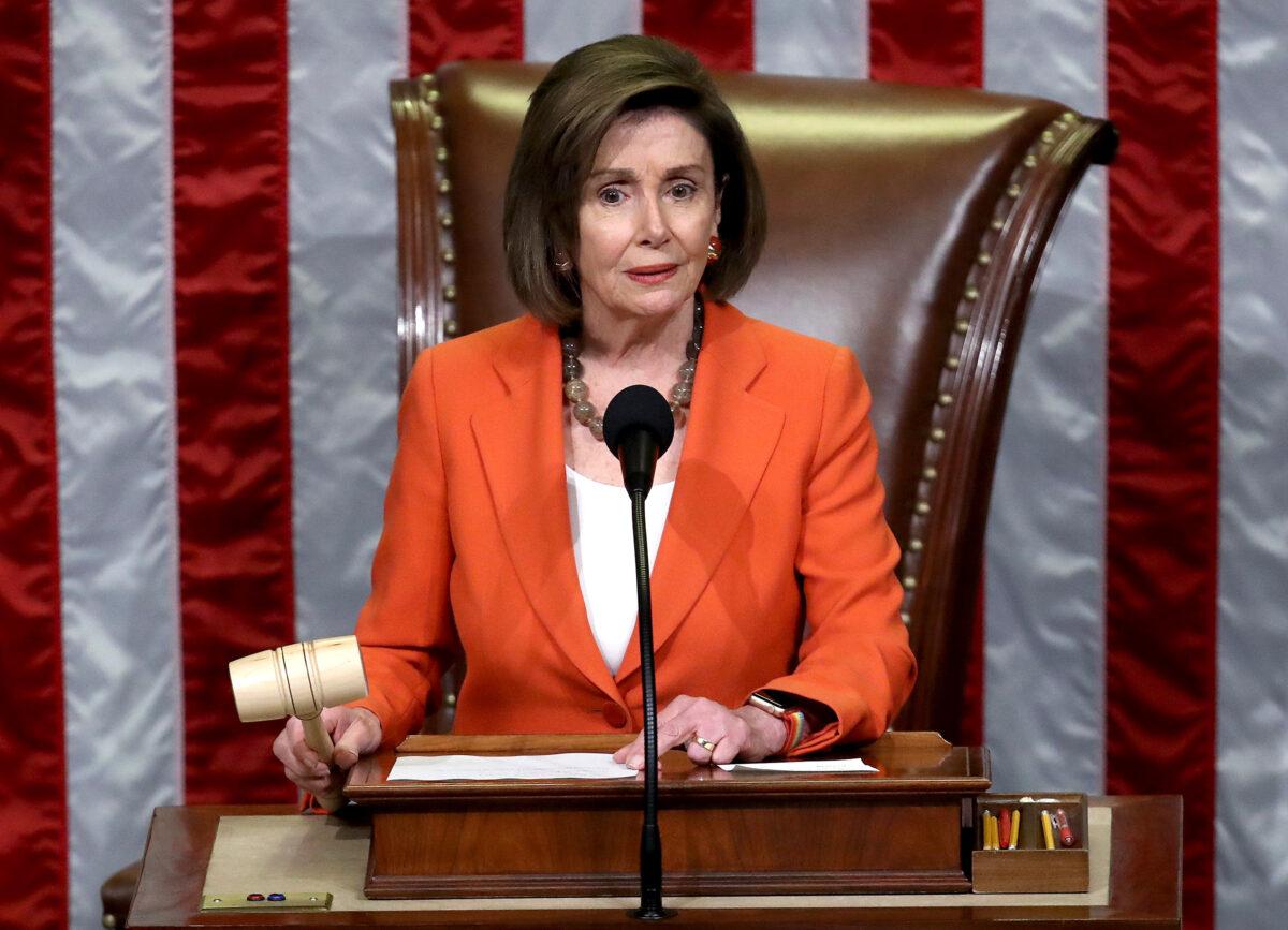 House Speaker Nancy Pelosi (D-Calif.) gavels the close of a vote by the House of Representatives on a resolution formalizing the impeachment inquiry centered on President Donald Trump in Washington on Oct. 31, 2019. (Win McNamee/Getty Images)