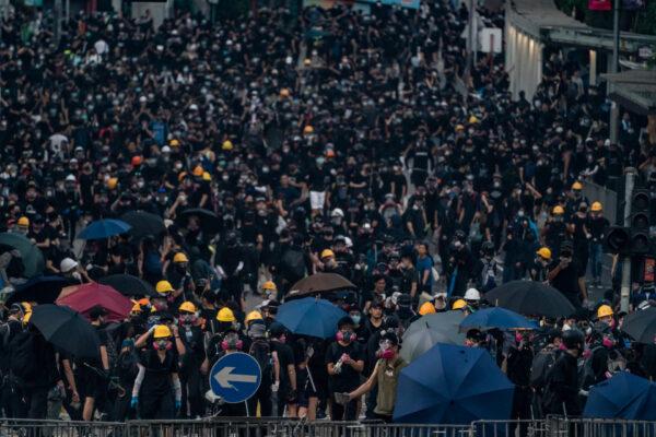 Pro-democracy protesters stand off with police during a demonstration in Wong Tai Sin district in Hong Kong, on Oct. 1, 2019. (Anthony Kwan/Getty Images)