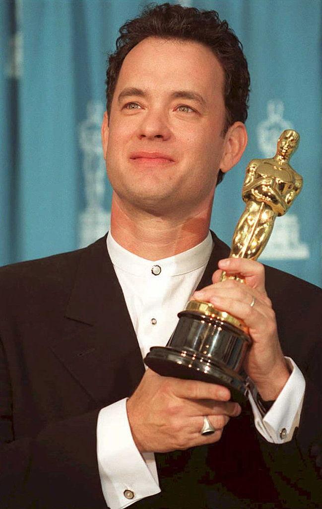 Tom Hanks posing with the Academy Award he received for Forrest Gump (©Getty Images | <a href="https://www.gettyimages.com/detail/news-photo/actor-tom-hanks-poses-with-his-oscar-27-march-at-the-67th-news-photo/51568799">JEFF HAYNES</a>)