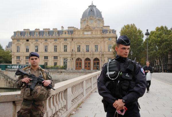 French police secure the area in front of the Paris Police headquarters in Paris, France on Oct. 3, 2019. (Philippe Wojazer/Reuters)