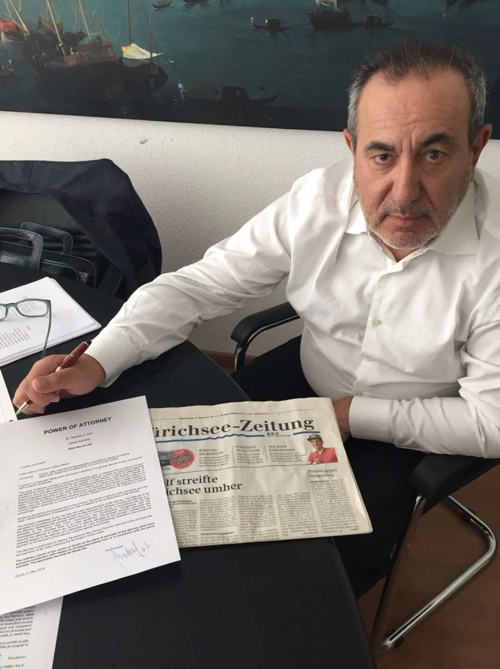 Joseph Mifsud in Zurich, Switzerland, in May 2018. The photo shows a signed power of attorney document dated May 21, 2018. (Courtesy of Stephan Roh)