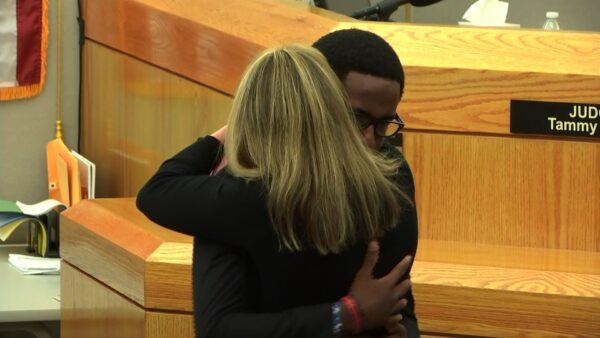 Brandt Jean, brother of shooting victim Botham Jean, was seen embracing his brother's shooter and neighbor Amber Guyger, 31, on the afternoon of Oct. 2 following her sentencing. Brandt Jean said he didn't want Guyger to go to prison for accidentally shooting her neighbor, and that he forgave her. (AP)