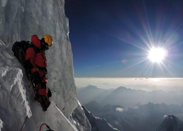 Adrian Hayes watches the sunrise while climbing K2. (Courtesy of Adrian Hayes)