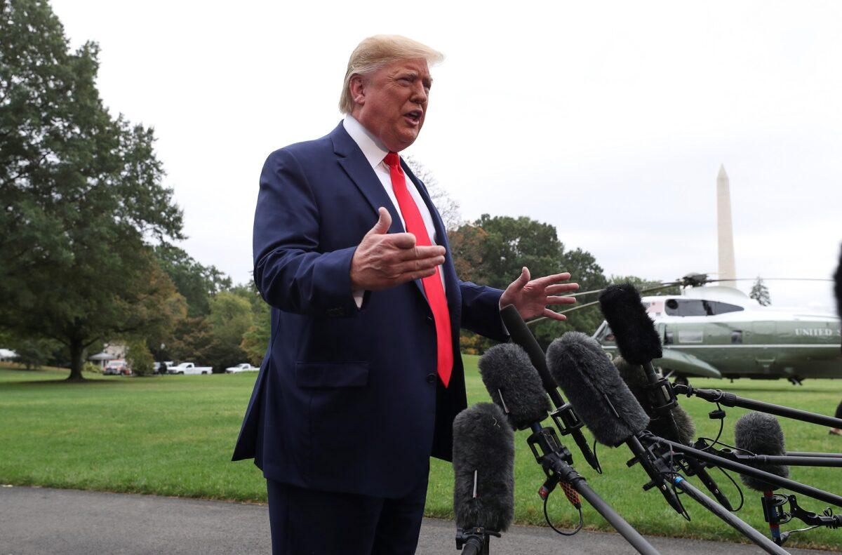 President Donald Trump talks to reporters as he departs for travel to Florida from the South Lawn of the White House in Washington on Oct. 3, 2019. (Leah Mills/Reuters)