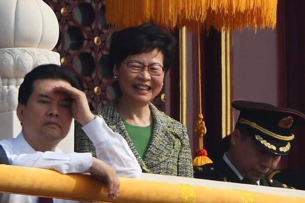 Hong Kong Chief Executive Carrie Lam (C) attends a military parade in Tiananmen Square in Beijing to mark the 70th anniversary of the founding of the People's Republic of China on Oct. 1, 2019. (GREG BAKER/AFP/Getty Images)