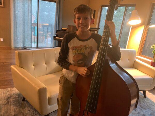 Dylan Combs with a double bass. (Courtesy of Danny Combs)