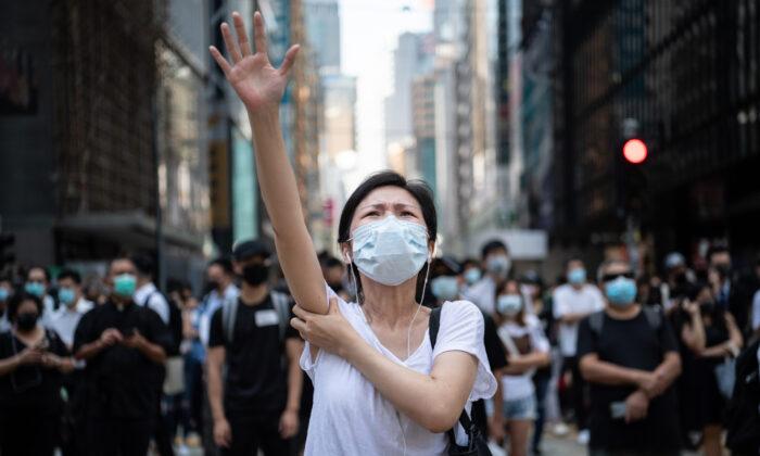 Beijing Claims Hong Kong Court Ruling on Mask Ban Invalid, Raising Concerns About City’s Rule of Law