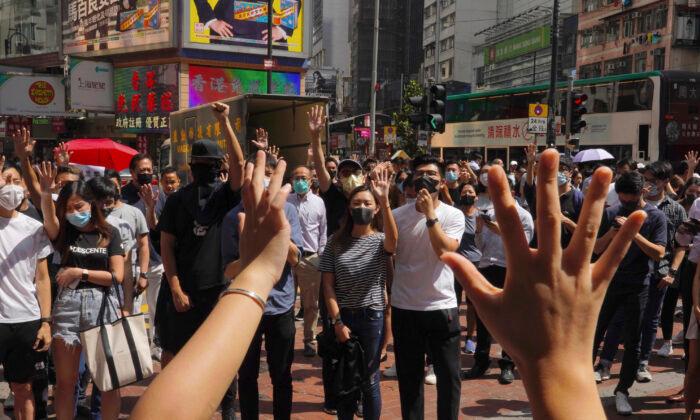 Thousands Protest Mask Ban as Hong Kong Leader Toughens Stance
