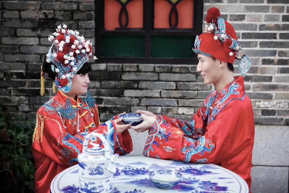 Illustration - Shutterstock | <a href="https://www.shutterstock.com/image-photo/couple-dressed-traditional-chinese-wedding-114352675?src=-Co6ooK9WYnHhpwsawxqYA-1-12">zhaoyan</a>