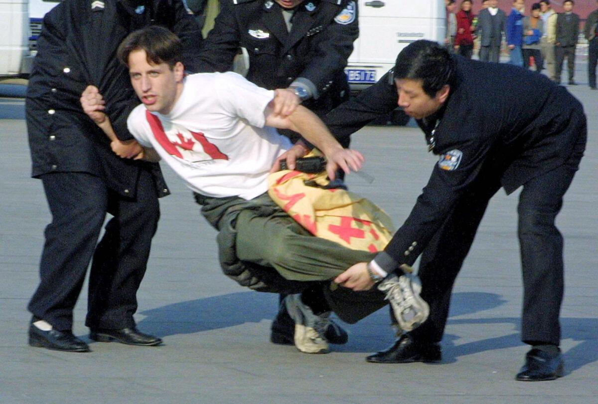 Zenon Dolnyckj, one of the 36 Westerners, caught by the police when he unfurled a banner and said out loud "Falun Dafa Is Good" in Beijing on Nov. 20, 2001. (AP Photo/Ng Han Guan)