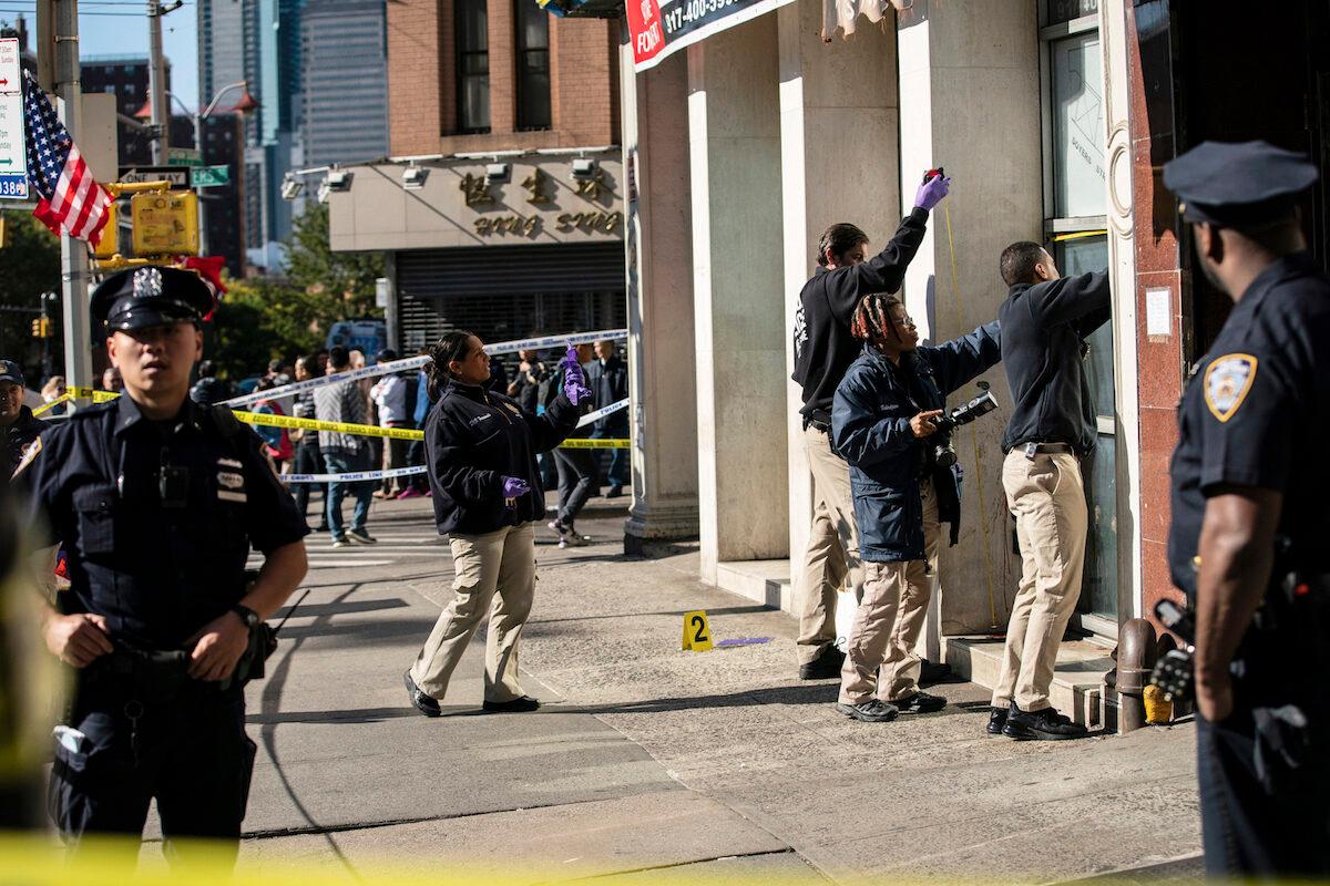 New York Police Department officers investigate the scene of an attack in Manhattan's Chinatown neighborhood, in New York City on Oct. 5, 2019. (Jeenah Moon/AP Photo)