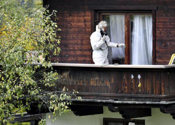 An investigator works on a balcony of a house in Kitzbühel, Austria, on Oct. 6, 2019. (Kerstin Joensson/AP Photo)