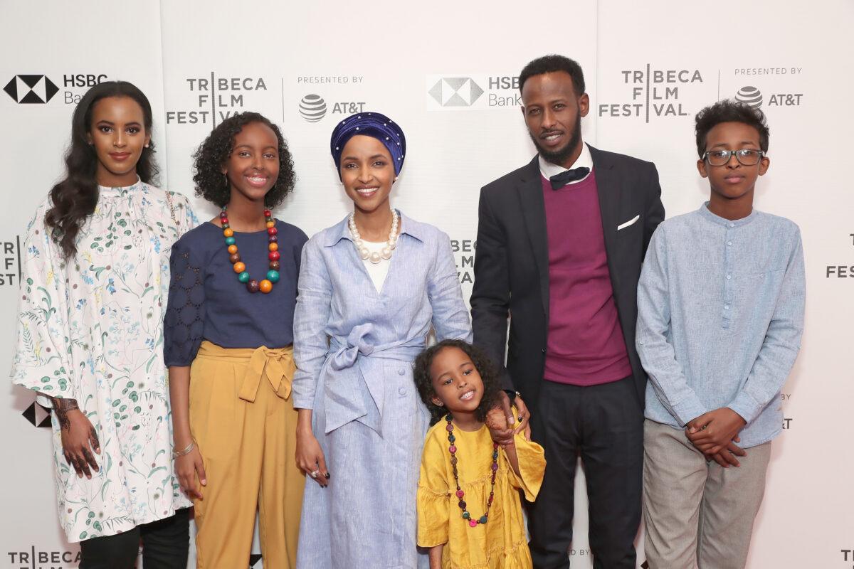 Amal Sabrie, left, Rep. Ilhan Omar (D-Minn.), third from left, and Ahmed Hirsi, second from right, in a 2018 file photograph with Omar's children in New York City. ( (Astrid Stawiarz/Getty Images for Tribeca Film Festival)