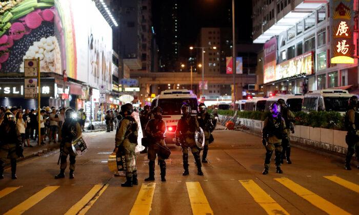 Hong Kong Police Retreat After Stand-Off With Residents