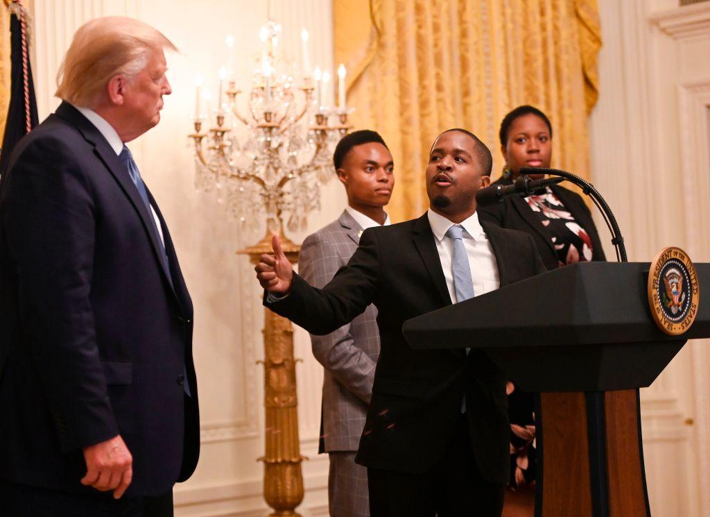 President Donald Trump (L) looks to Terrence Williams as he speaks during the Young Black Leadership Summit at the White House in Washington on Oct. 4, 2019. (Andrew Caballero-Reynolds/AFP via Getty Images)