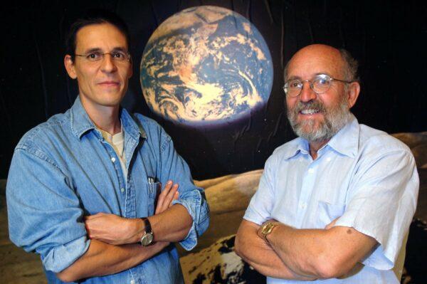 Swiss Astronomers Michel Mayor, right, and Didier Queloz, left, pose for the photographer at the Astronomical Observatory of the University of Geneva. on Aug. 11, 2005. (Laurent Gillieron, Keystone via AP)