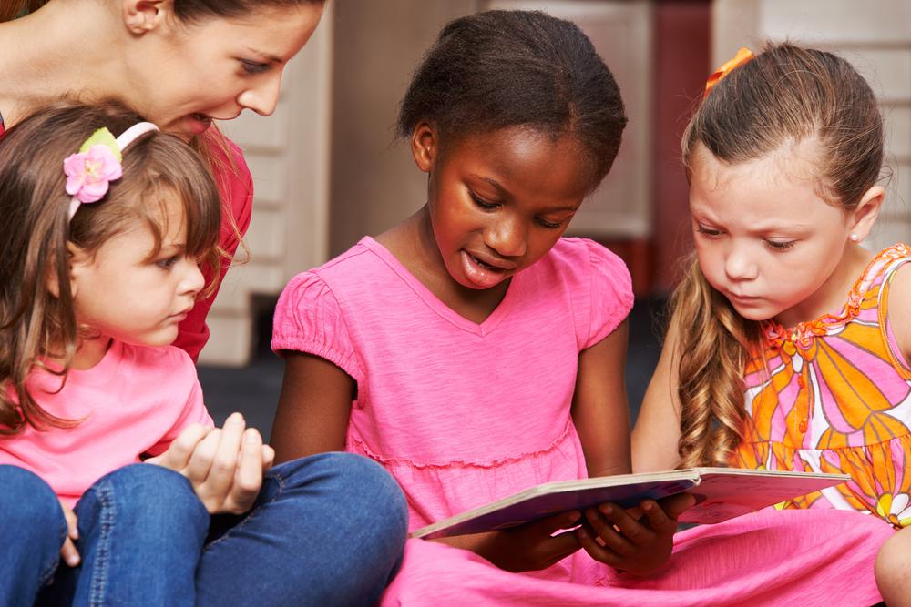 Illustration - Shutterstock | <a href="https://www.shutterstock.com/image-photo/children-learning-read-nursery-teacher-preschool-264896012">Robert Kneschke</a>