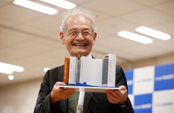 Asahi Kasei honorary fellow Akira Yoshino, 2019 Nobel Prize in Chemistry winner, holds a mock of lithium-ion battery during a news conference in Tokyo, Japan on Oct. 9, 2019. (Issei Kato/Reuters)