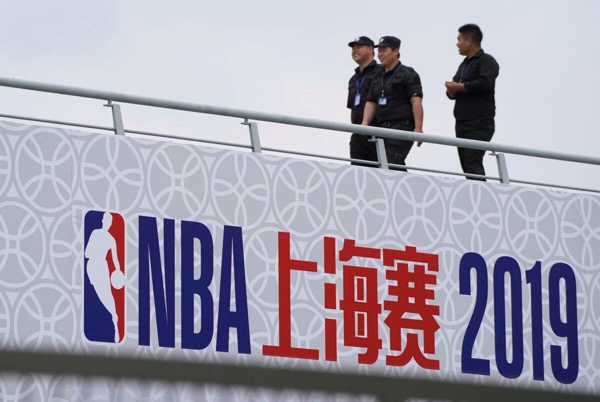 Security personnel are seen at the venue that was scheduled to hold fan events ahead of an NBA China game between Brooklyn Nets and Los Angeles Lakers, at the Oriental Sports Center in Shanghai, China on Oct. 9, 2019. (Aly Song/Reuters)