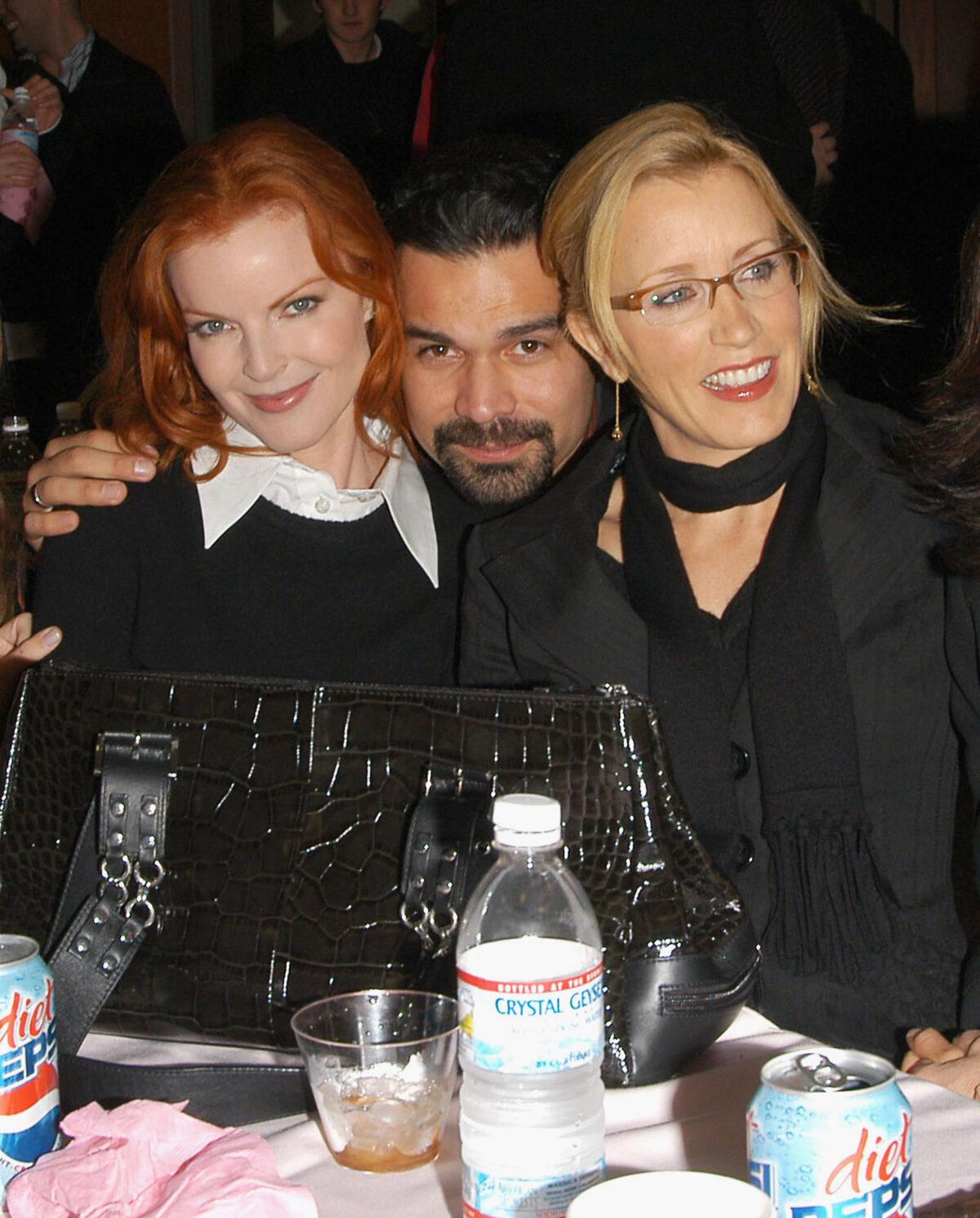From left to right: Actors Marcia Cross, Ricardo Antonio Chavira, and Felicity Huffman pose at a "Desperate Housewives" event in a 2005 file photograph. (Stephen Shugerman/Getty Images)