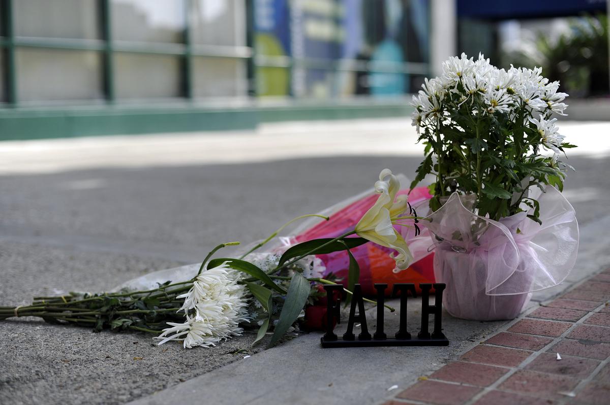 Flowers are placed in front of the building at the 900 block of South Flower Street where Marie Osmond's son Michael Blosil committed suicide in Los Angeles, California on Feb. 28, 2010. (Photo by Toby Canham/Getty Images)