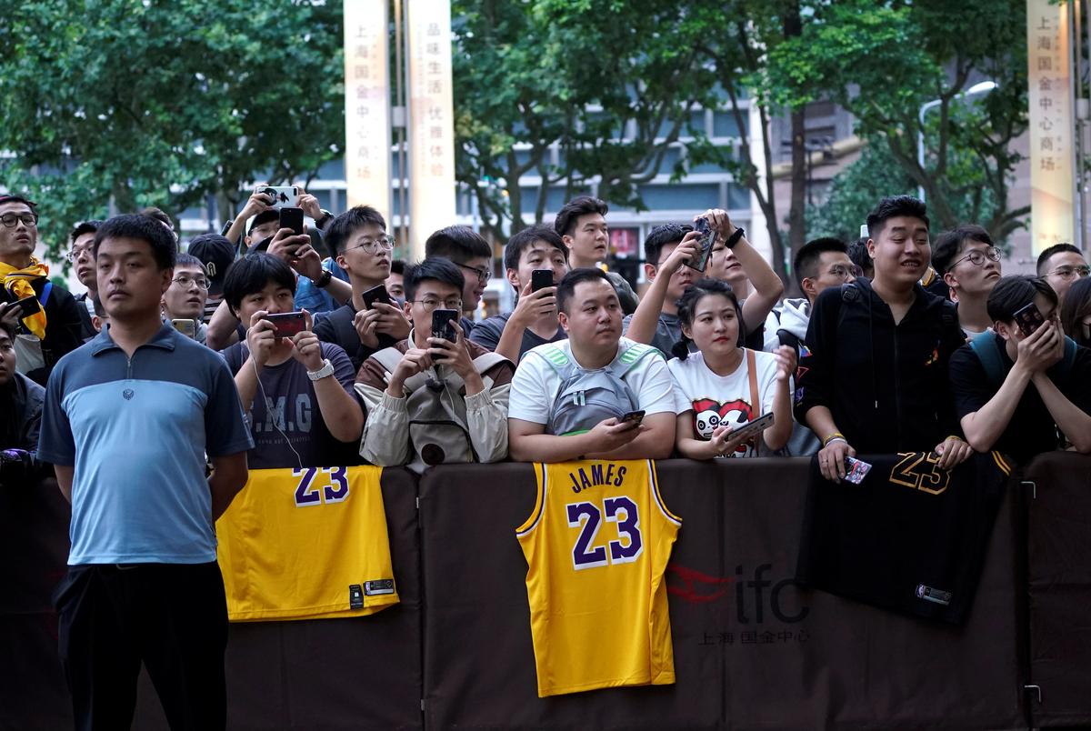 NBA fans wait outside a Ritz-Carlton hotel in Shanghai, China on Oct. 9, 2019. (Aly Song/Reuters)