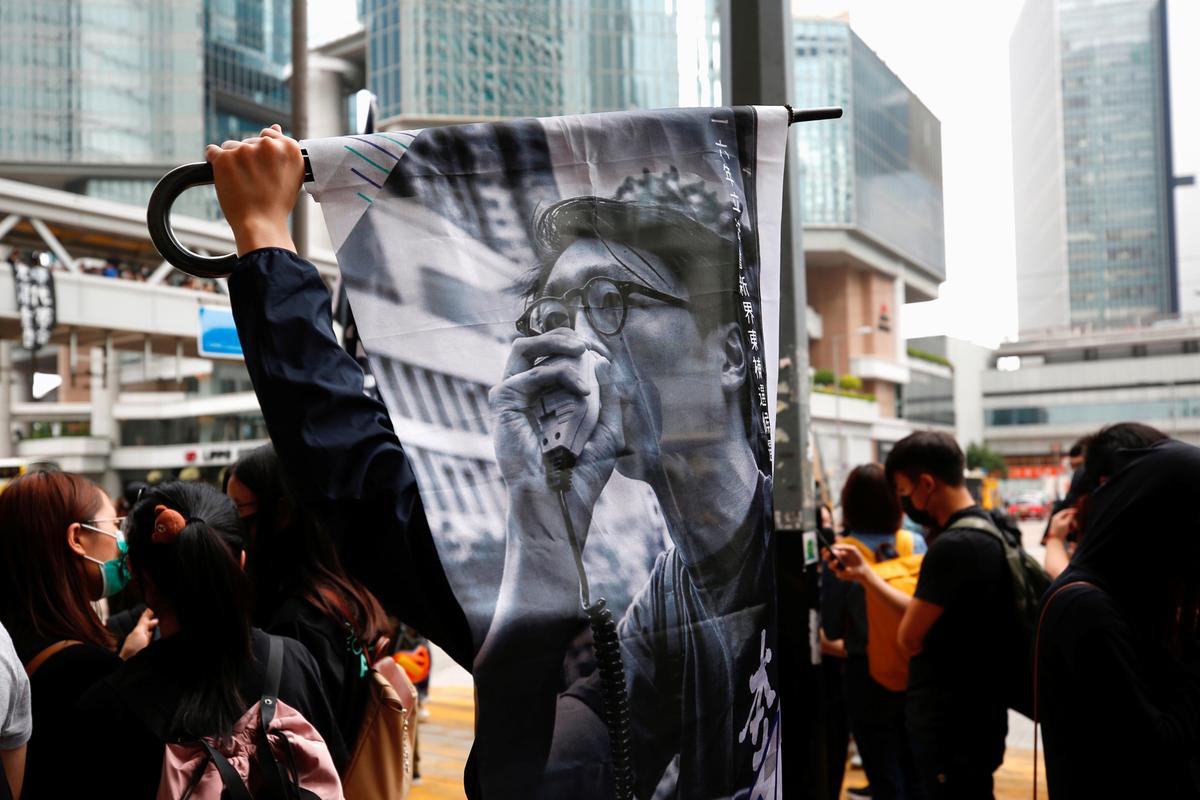 Supporters of jailed activist Edward Leung, gather outside the High Court as Leung appeals against his conviction and sentence, in Hong Kong, China on Oct. 9, 2019. (Tyrone Siu/Reuters)