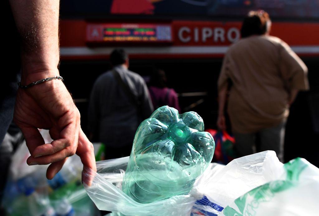 Reverse vending machines are stationed at Cipro on the Rome metro's A line, Piramide on the B line, and San Giovanni on the C line. (©Getty Images | <a href="https://www.gettyimages.com.au/detail/news-photo/commuters-line-up-to-trade-plastic-bottles-for-transit-news-photo/1174493142">TIZIANA FABI/AFP</a>)