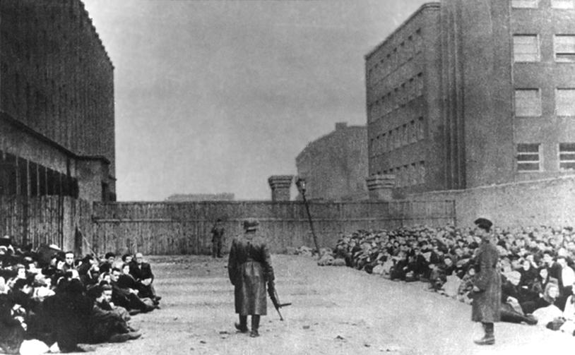 Jews awaiting deportation at the Umschlagplatz holding area (<a href="https://commons.wikimedia.org/wiki/File:Umschlagplatz_Warsaw_Ghetto_01.jpg">Wikimedia Commons</a>)