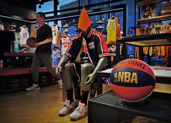 A Chinese flag is seen placed on a mannequin wearing the USA basketball uniform in the NBA flagship retail store in Beijing on Oct. 9, 2019. (Kevin Frayer/Getty Images)