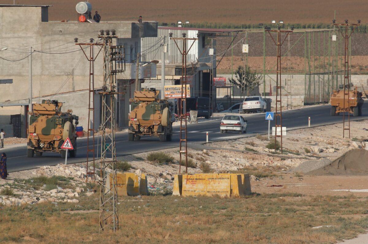Shortly after the Turkish operation inside Syria had started,a convoy of Turkish forces vehicles is driven through the town of Akcakale, Sanliurfa province, southeastern Turkey, at the border between Turkey and Syria, on Oct. 9, 2019. Turkey launched a military operation Wednesday against Kurdish fighters in northeastern Syria after U.S. forces pulled back from the area, with a series of airstrikes hitting a town on Syria's northern border.(Lefteris Pitarakis/AP Photo)