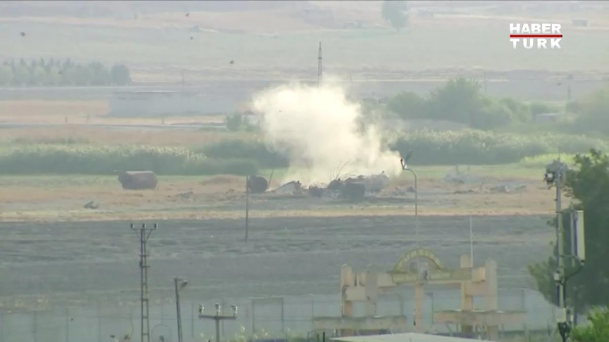 Smoke rises from an explosion in the border town of Tel Abyad, Syria, as seen from Akcakale, Turkey Oct. 9, 2019, in this still image taken from video. (Haberturk/via Reuters TV)
