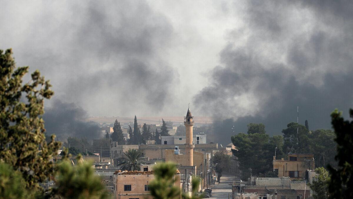 Smoke rises over the Syrian town of Tel Abyad, as seen from the Turkish border town of Akcakale in Sanliurfa province, Turkey, on Oct. 10, 2019. (Murad Sezer/Reuters)