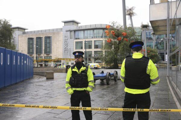Police outside the Arndale Centre after a stabbing incident at the shopping center that left five people injured, in Manchester, England, on Oct. 11, 2019. (Peter Byrne/PA via AP)