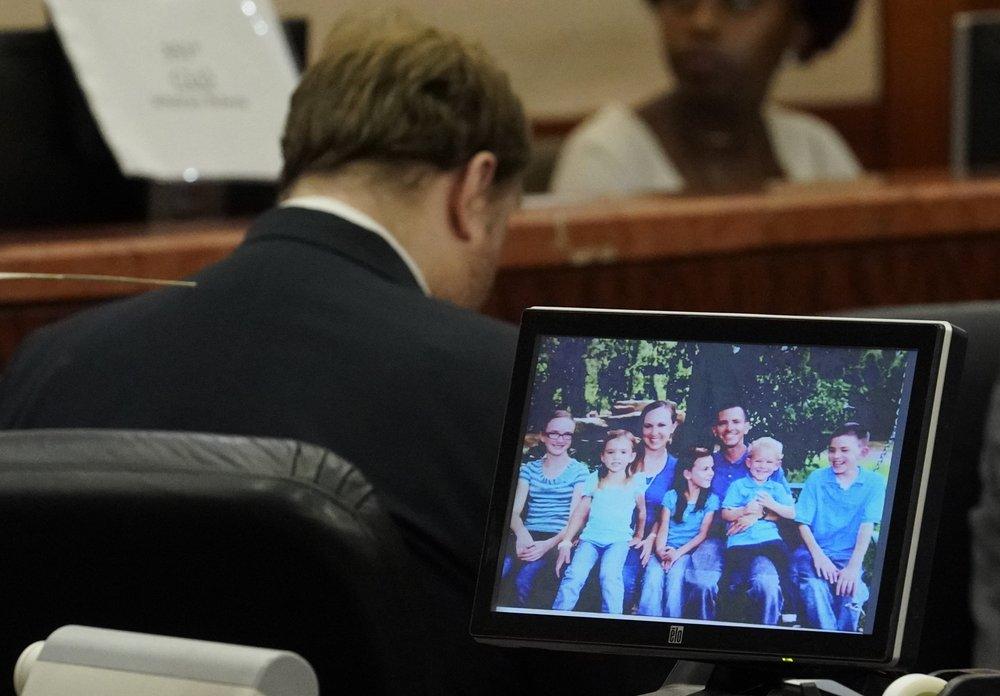 Ronald Lee Haskell sits with his head down as a photo of the Stay family is shown during the sentencing phase for Haskell in Houston, Texas on Oct. 11, 2019 . (Melissa Phillip/Houston Chronicle via AP)