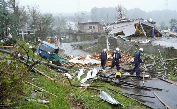 Destroyed houses, cars and power poles, which according to local media were believed to be caused by a tornado, are seen as Typhoon Hagibis approaches the Tokyo area in Ichihara, east of Tokyo, Japan, in this photo taken by Kyodo on Oct. 12, 2019. (Courtesy of Kyodo/via Reuters)
