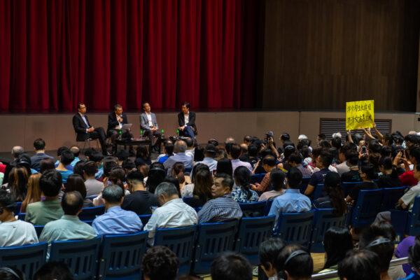Students hold a banner as Professor Rocky Tuan Sung-Chi, Vice-Chancellor and President of the Chinese University of Hong Kong, hold an open meeting with Hong Kong Chinese University's student in Hong Kong, on Oct. 10, 2019. (Billy H.C. Kwok/Getty Images)