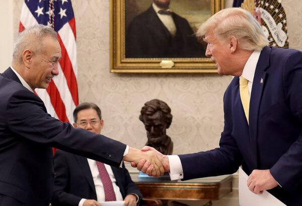 President Donald Trump shakes hands with Chinese Vice Premier Liu He after announcing a "phase one" trade agreement with China in the Oval Office at the White House in Washington D.C on Oct. 11, 2019. (Win McNamee/Getty Images)