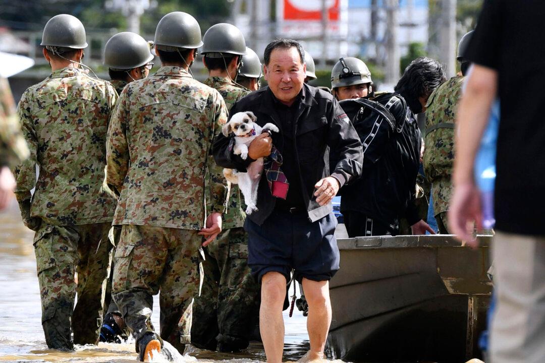 Japan Sends Troops After Deadly Typhoon Floods Towns, Threatens More Damage