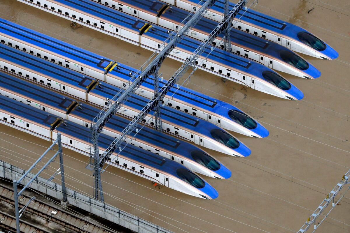 Bullet trains are seen submerged in muddy waters in Nagano, central Japan, after Typhoon Hagibis hit the city, on Oct. 13, 2019. (Yohei Kanasashi/Kyodo News via AP)
