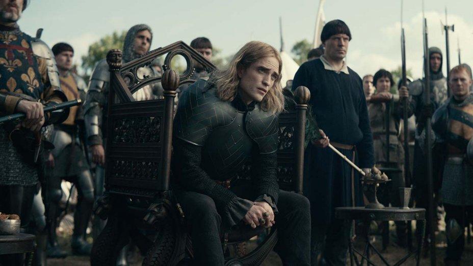 Robert Pattinson (C) plays the eldest son of the king of France, in "The King." (Netflix)