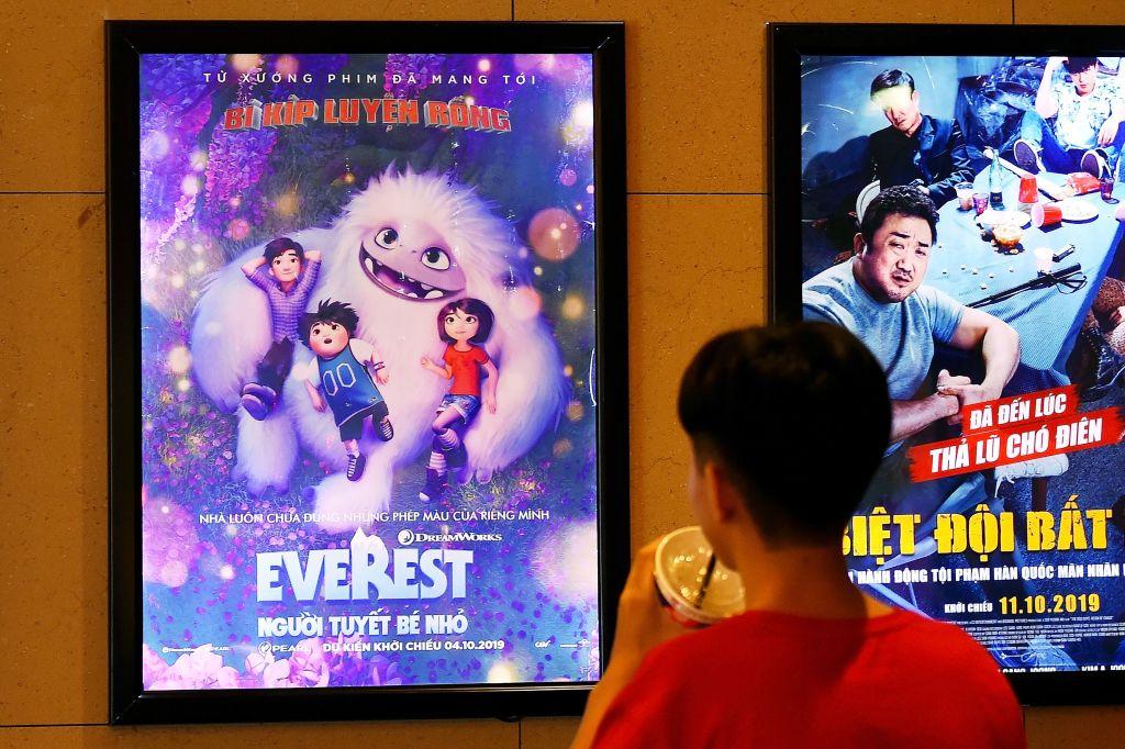A boy looks at a poster for the animated movie "Everest Nguoi Tuyet Be Nho," also known as "Abominable," at a movie theater in Hanoi on Oct. 14, 2019. (Nhac Nguyen/AFP via Getty Images)