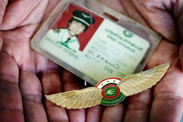 A pilot (not the one in this story) hands over his "wings" and identity card in a file photo. (Ian Waldie/Getty Images)