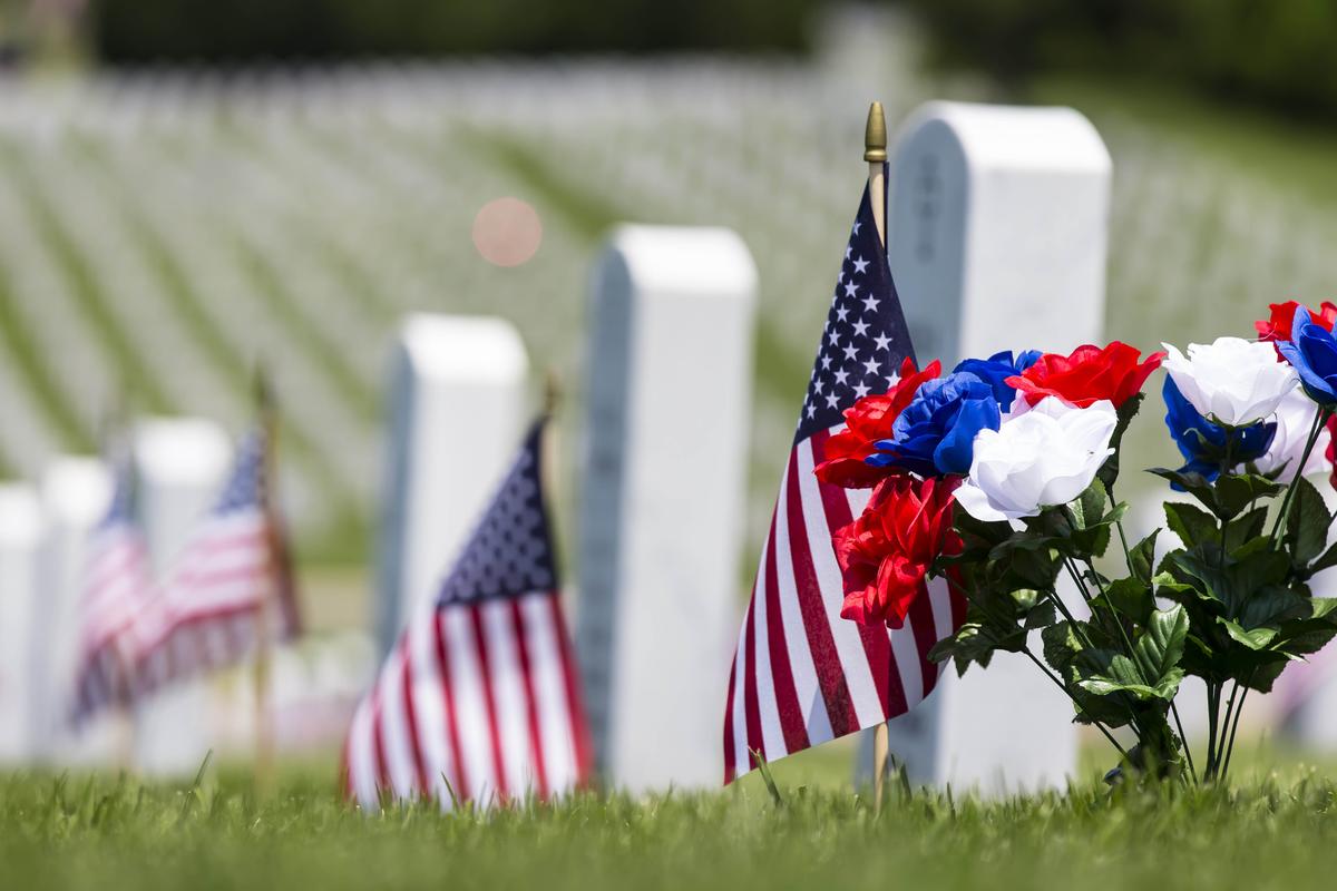 Illustration - Shutterstock | <a href="https://www.shutterstock.com/image-photo/veterans-cemetery-memorial-celebration-american-flag-195247490?src=cXBogdOW35aiKYSRH3Rsng-1-6">Action Sports Photography</a>