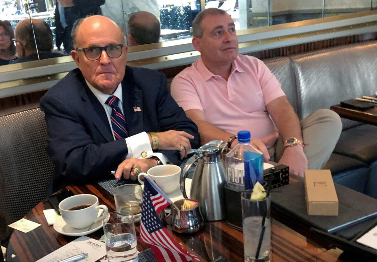 President Donald Trump's personal lawyer Rudy Giuliani has coffee with Ukrainian American businessman Lev Parnas at the Trump International Hotel in Washington on Sept. 20, 2019. (Aram Roston/File Photo/Reuters)