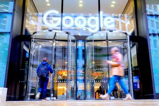 People walk past Google's UK headquarters in London on November 1, 2018. (Tolga Akmen/AFP/Getty Images)