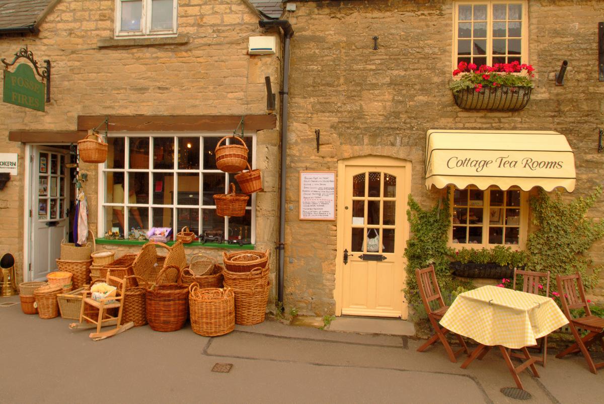 Stow-on-the-Wold has lots of nice galleries and is the best town to shop for antiques. It is famous for a large market square. Its green still has wooden stocks once used to punish petty criminals. (Fred J. Eckert)